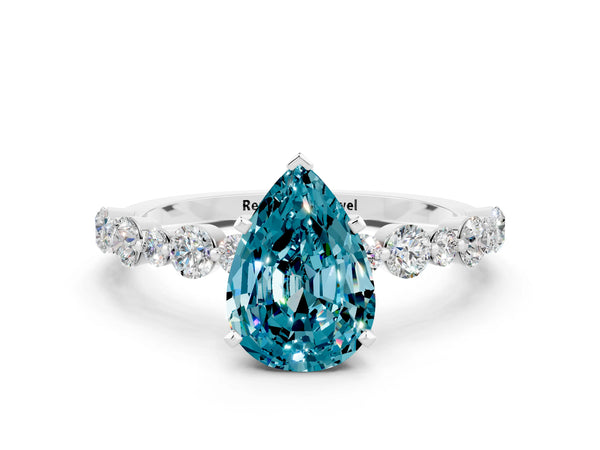 Silver Pear Cut Blue Topaz Prong Set Engagement Ring with Pavé Band