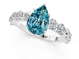 White gold Pear Cut Blue Topaz Prong Setting with Side Stones on a Pave Band_1