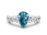 White gold Pear Cut Blue Topaz Prong Setting with Side Stones on a Pave Band