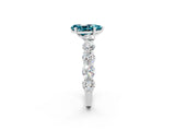 White gold Pear Cut Blue Topaz Prong Setting with Side Stones on a Pave Band_2