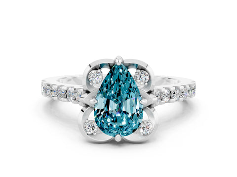 White gold Pear Cut Blue Topaz Ring with Pavé Band and Floral Prong Setting
