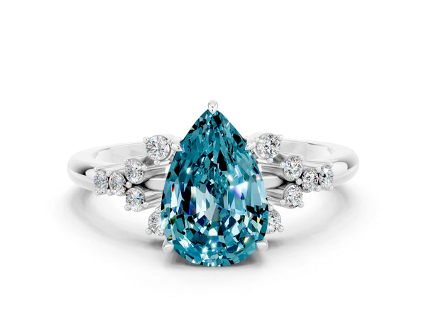 White gold Pear Cut Blue Topaz Ring with Side Stones and Four-Prong Setting