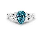 White gold Pear Cut Blue Topaz Solitaire Engagement Ring with Celtic Knot Band and Four-Prong Setting