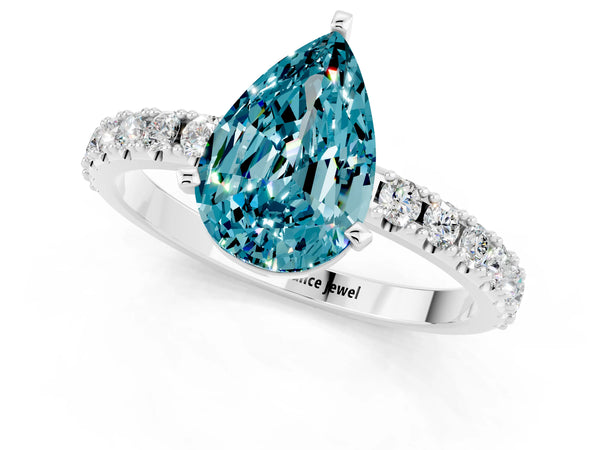 Platinum Pear Cut Blue Topaz Solitaire Pavé Band with Four-Prong Setting