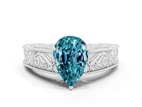 White gold Pear Cut Blue Topaz Solitaire Ring with Engraved Band and Four-Prong Setting
