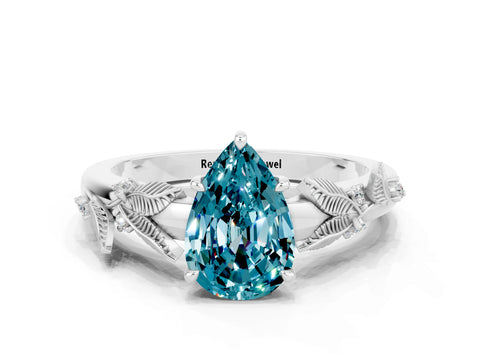 White gold Pear Cut Blue Topaz Solitaire Ring with Leaf Motif Band and Four-Prong Setting_12