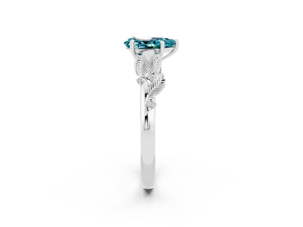 Platinum Pear Cut Blue Topaz Solitaire Ring with Leaf Motif Band and Four-Prong Setting