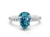 White gold Pear Cut Blue Topaz Solitaire Ring with Pavé Accents and Four-Prong Setting