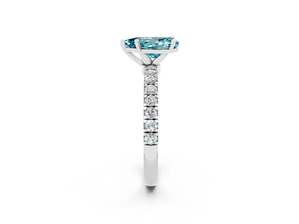 Platinum Pear Cut Blue Topaz Solitaire Ring with Pavé Accents and Four-Prong Setting