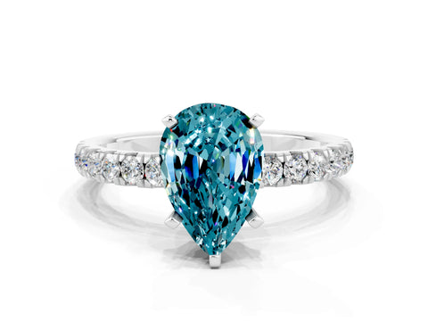 White gold Pear Cut Blue Topaz Solitaire Ring with Pavé Accents and Four-Prong Setting