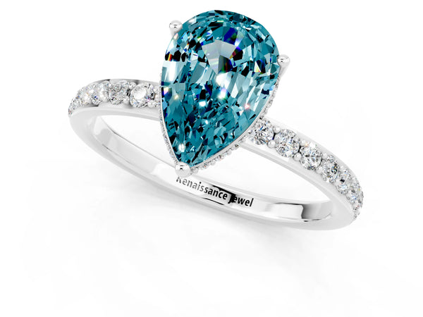 Platinum Pear Cut Blue Topaz Solitaire Ring with Pavé Band and Hidden Halo