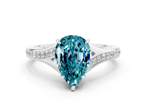 White gold Pear Cut Blue Topaz Solitaire Ring with Pavé Band and Prong Setting