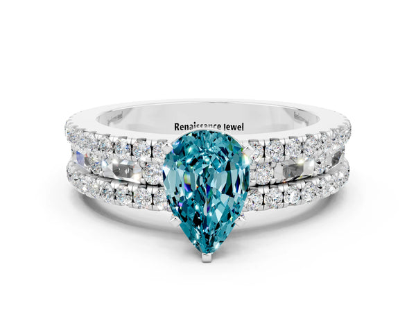 Silver Pear Cut Blue Topaz Solitaire Ring with Pavé and Channel Set Band