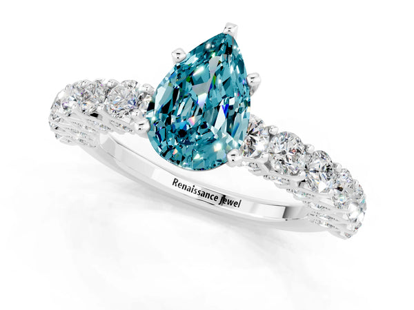 Silver Pear Cut Blue Topaz Solitaire Ring with Shared Prong Pavé Band and Four-Prong Setting