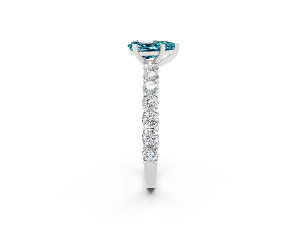 Silver Pear Cut Blue Topaz Solitaire Ring with Shared Prong Pavé Band and Four-Prong Setting