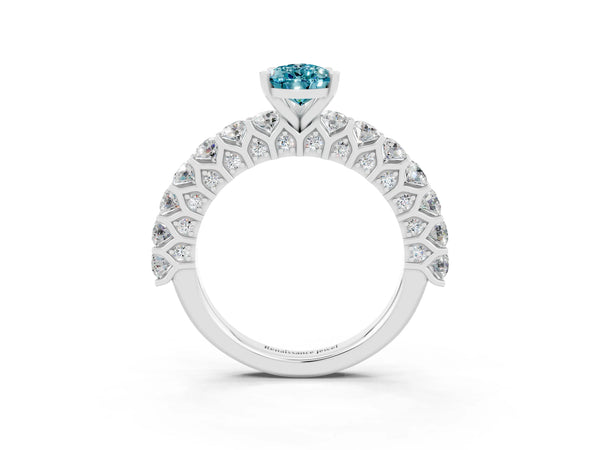 Platinum Pear Cut Blue Topaz Solitaire Ring with Shared Prong Pavé Band and Four-Prong Setting