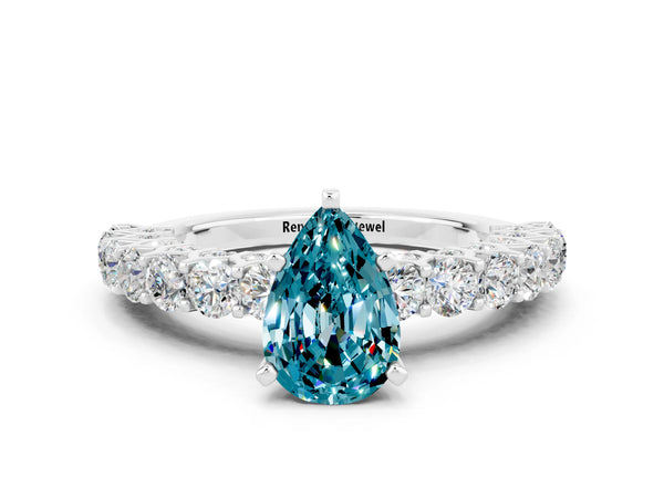 White gold Pear Cut Blue Topaz Solitaire Ring with Shared Prong Pavé Band and Four-Prong Setting