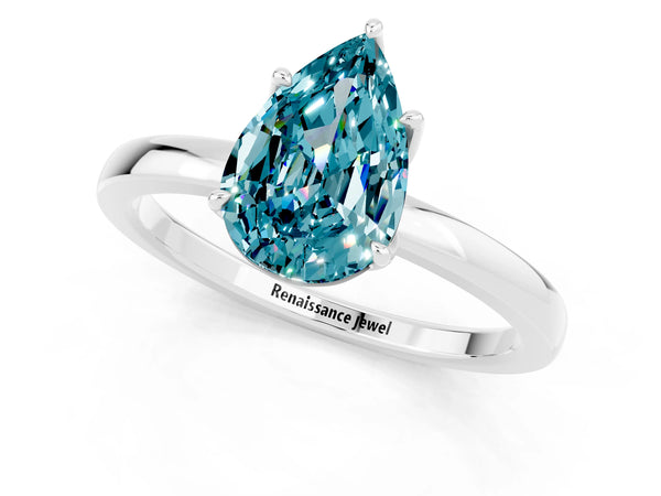 Platinum Pear Cut Blue Topaz Solitaire Ring with Thin Band and Prong Setting