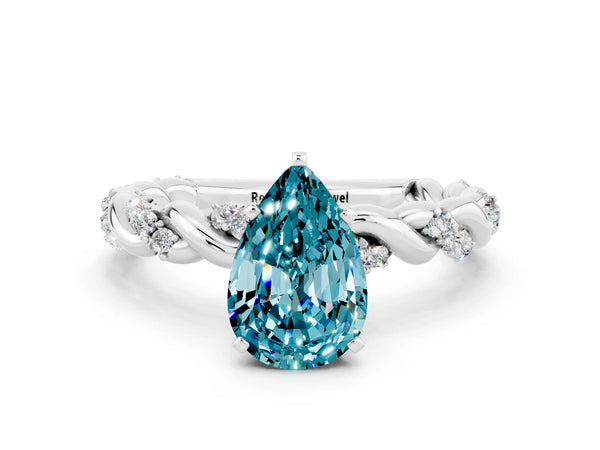 Platinum Pear Cut Blue Topaz Solitaire Ring with Twisted Band and Pavé Accents