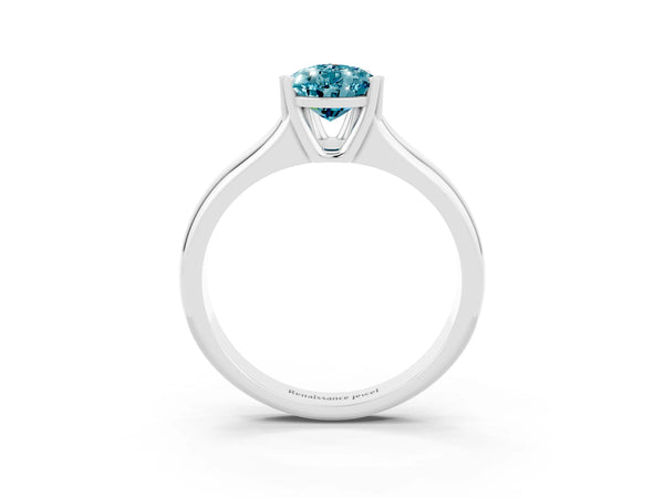 Silver Pear Cut Blue Topaz Solitaire Ring with Wide Band and Prong Setting