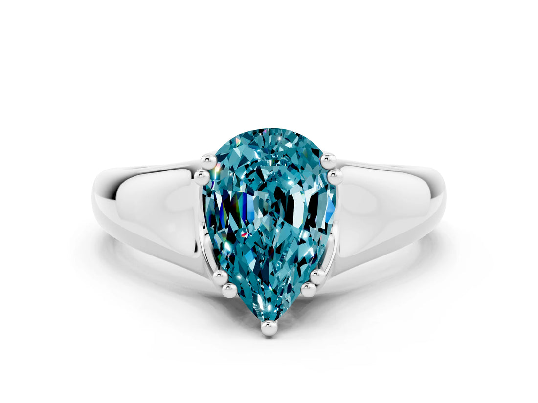 White gold Pear Cut Blue Topaz Solitaire Ring with Wide Band and Prong Setting