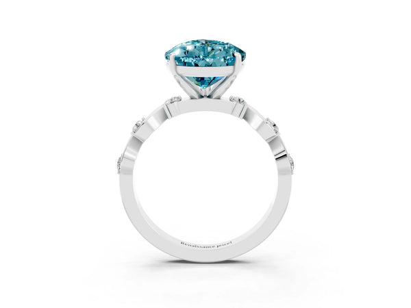 Platinum Pear Cut Blue Topaz Solitaire Twisted Band with Round  Accents and Prong Setting