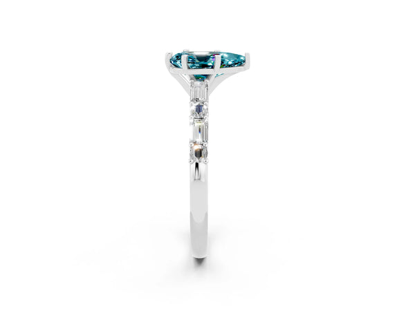 White gold Pear Cut Blue Topaz Solitaire with Side Baguettes and Channel Set Band