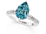 White gold Pear Cut Blue Topaz Solitaire with Side Baguettes and Channel Set Band_37