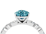 White gold Pear Cut Blue Topaz Solitaire with Side Stones on a Pavé Band and Four-Prong Setting_4