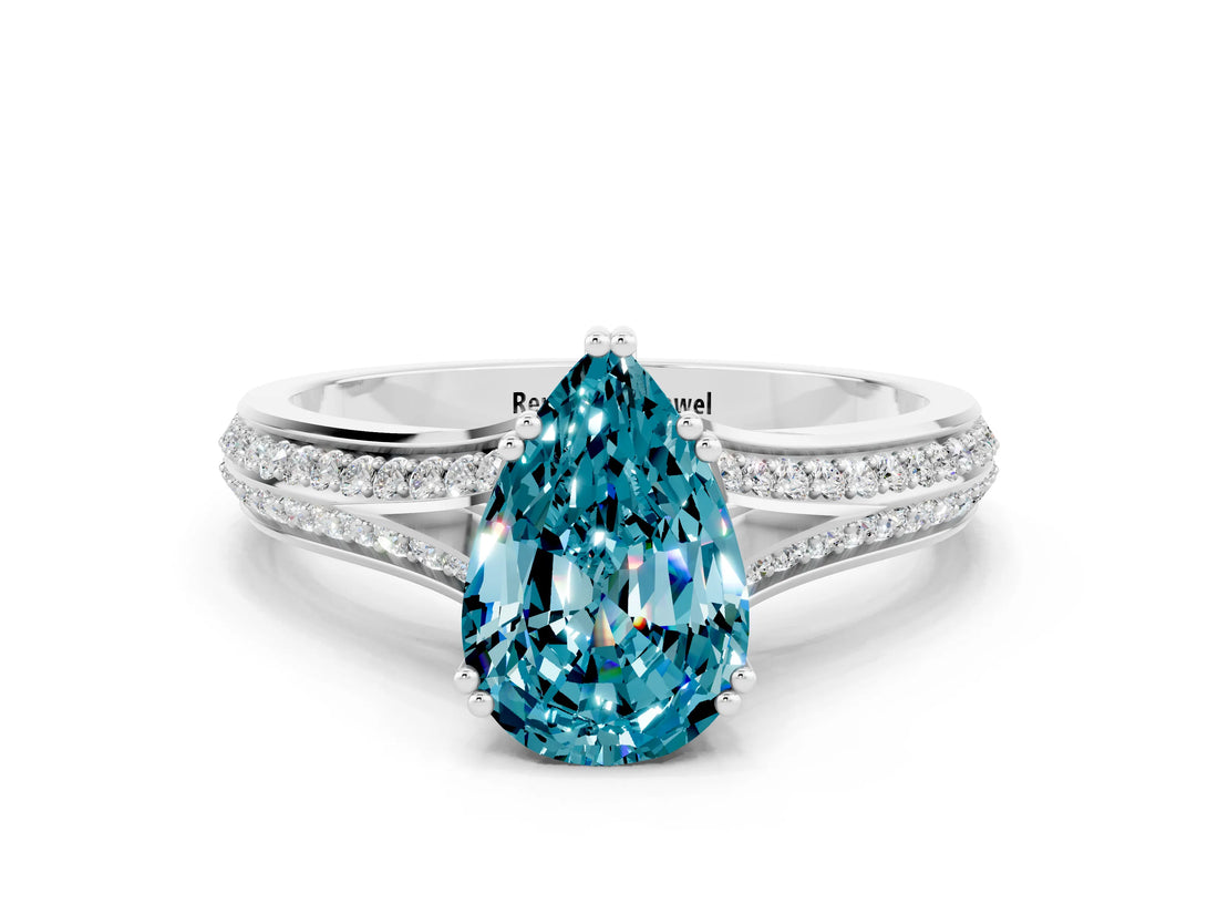 White gold Pear Cut Blue Topaz Split Shank Engagement Ring with Pavé Band
