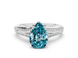 White gold Pear Cut Blue Topaz Split Shank Engagement Ring with Pavé Band