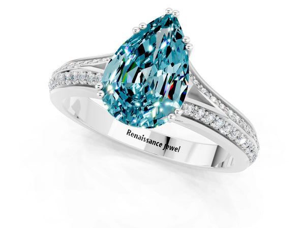 White gold Pear Cut Blue Topaz Split Shank Engagement Ring with Pavé Band