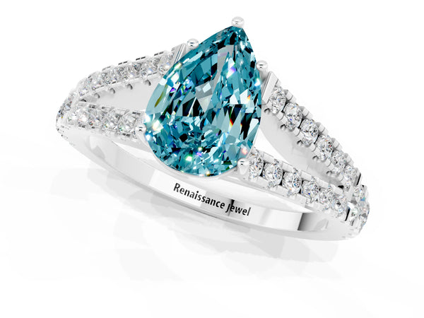 White gold Pear Cut Blue Topaz Split Shank Pavé Engagement Ring with Four-Prong Setting