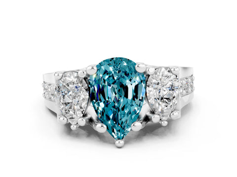 White gold Pear Cut Blue Topaz Three-Stone Ring with Channel Set Band and Four-Prong Setting