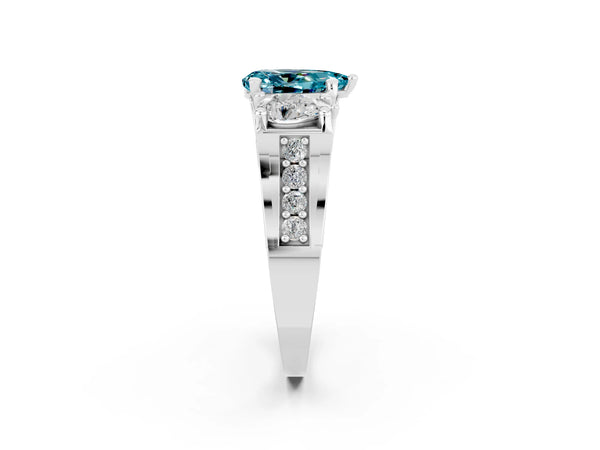 Platinum Pear Cut Blue Topaz Three-Stone Ring with Channel Set Band and Four-Prong Setting