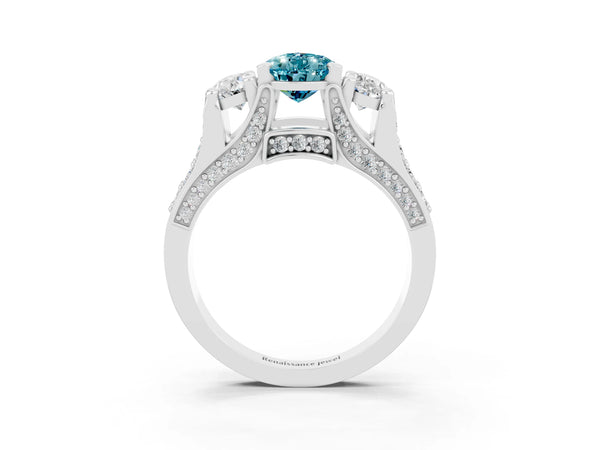Platinum Pear Cut Blue Topaz Three-Stone Ring with Channel Set Band and Four-Prong Setting