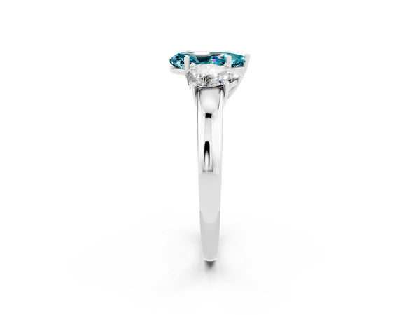White gold Pear Cut Blue Topaz Three-Stone Ring with Four-Prong Setting and Classic Band