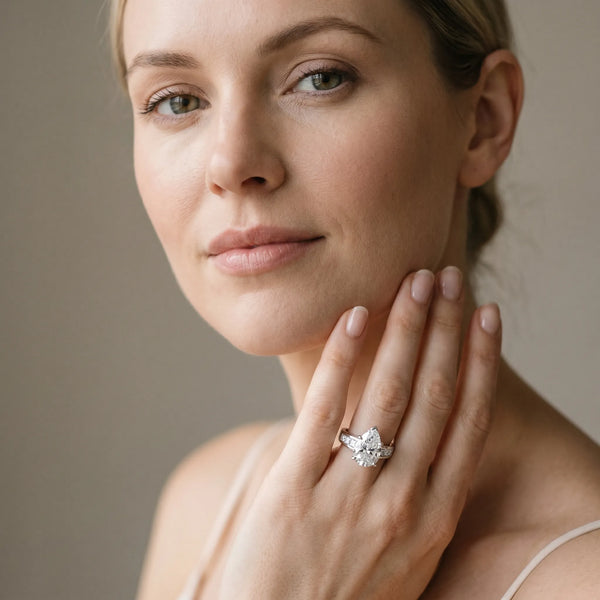 White gold Pear Cut Channel Set Solitaire Ring with Four-Prong Setting