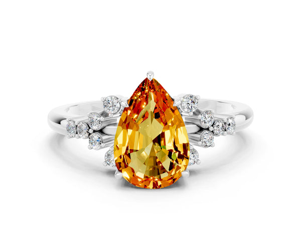 Silver Pear Cut Citrine Ring with Side Stones and Four-Prong Setting