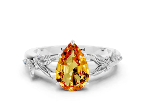 White gold Pear Cut Citrine Solitaire Ring with Leaf Motif Band and Four-Prong Setting