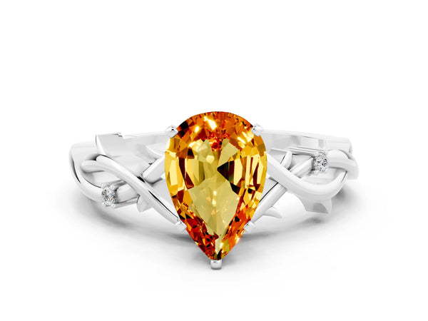 Silver Pear Cut Citrine Solitaire Ring with Twisted Band and Prong Setting