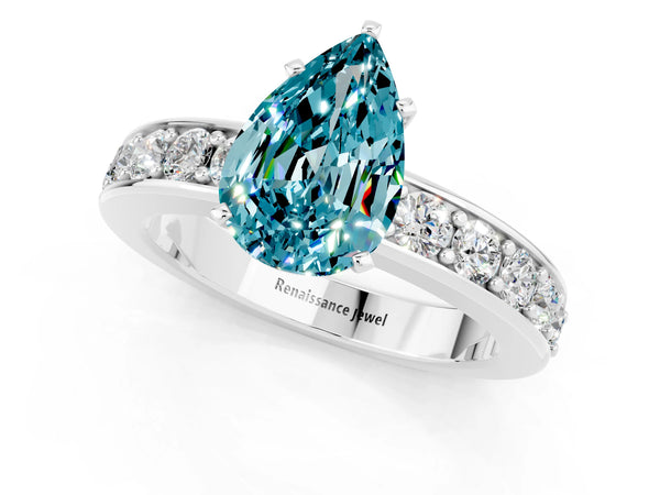 Silver Pear Cut Blue Topaz Engagement Ring with Channel Set Round  Band and Prong Setting