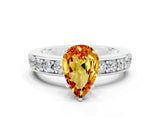 White gold Pear Cut Cut Channel Set Diamond Engagement Ring with Four-Prong Setting
