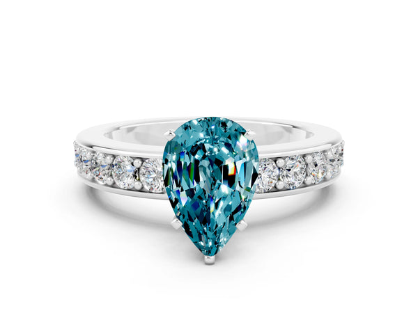 Platinum Pear Cut Blue Topaz Engagement Ring with Channel Set Round  Band and Prong Setting