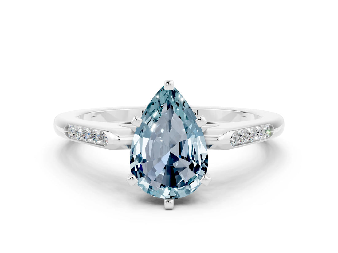 White gold Pear Cut Cut Channel Set Solitaire Engagement Ring with Four-Prong Setting