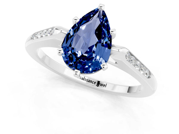 Silver Pear Cut Blue Sapphire Solitaire Ring with Channel Set Round Band and Prong Setting