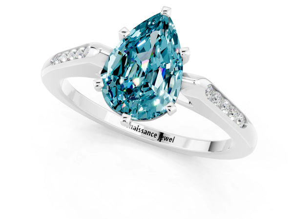 White gold Pear Cut Blue Topaz Solitaire Ring with Channel Set Round Band and Prong Setting
