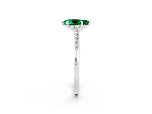 Platinum Pear Cut Emerald Solitaire Ring with Channel Set Round Band and Prong Setting
