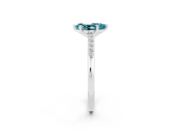 White gold Pear Cut Blue Topaz Solitaire Ring with Channel Set Round Band and Prong Setting