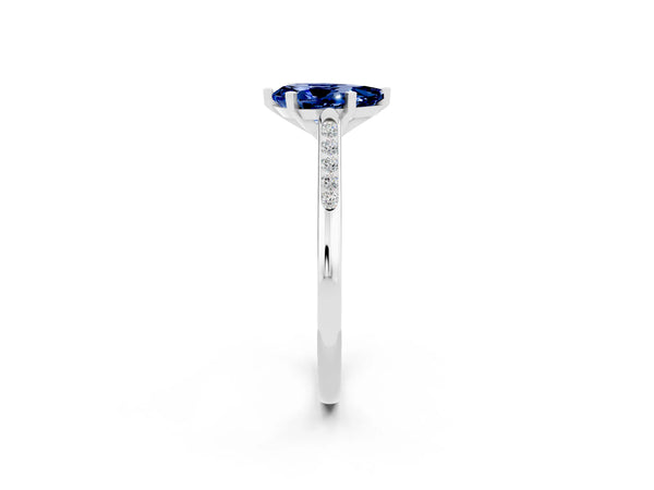 White gold Pear Cut Blue Sapphire Solitaire Ring with Channel Set Round Band and Prong Setting